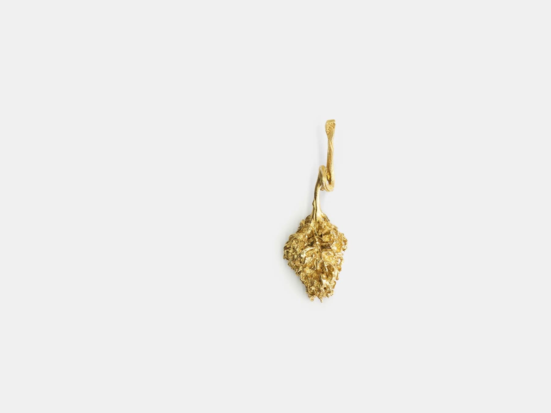 Gold pendant from the plant-based lifestyle brand's collection